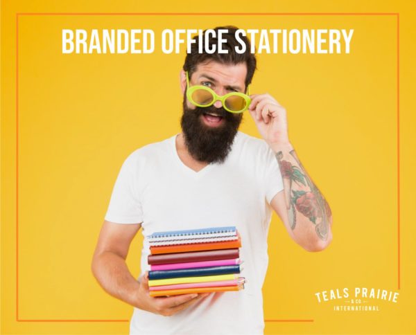 cool guy wearing sunglasses holding stack of branded stationery