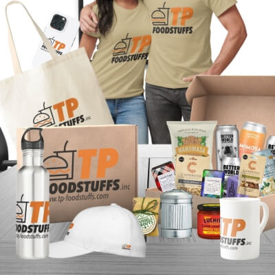couple wearing promotional T shirts and caps and mugs in foreground, Lots of luxury gift ideas in gift box beside.